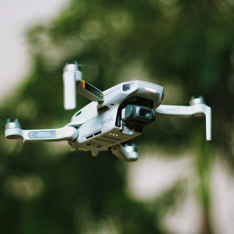Drone flying in front of trees