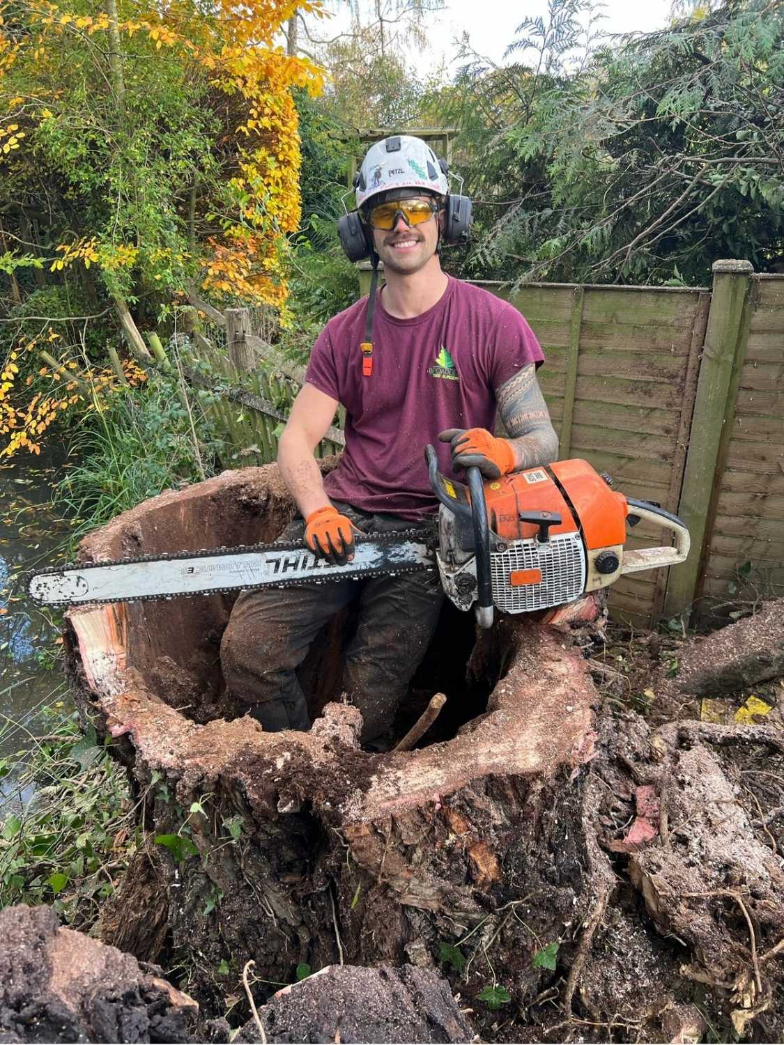 A tree surgeon from Broadleaf Tree Surgery holding a chainsaw